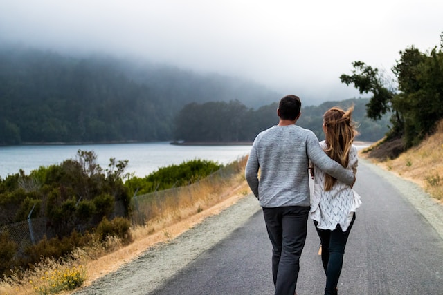 Couple walking together on a road