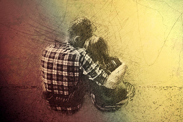 A man sitting with his arm around a woman
